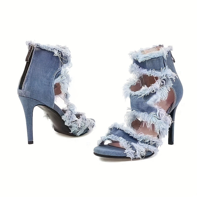 Denim high-heeled sandals with frayed edges on a white background