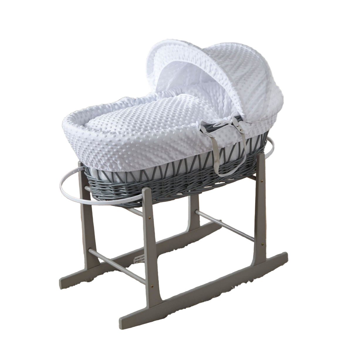 Gray wicker Moses basket with white hood and mattress on a stand in a nursery.