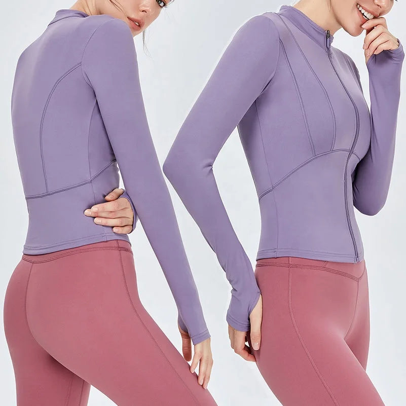 Purple athletic top and pink leggings on a white background