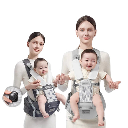 Two women holding a baby in a baby carrier with Aibedila logo.