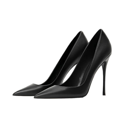 Black high-heeled shoes on a wooden stool with a neutral background