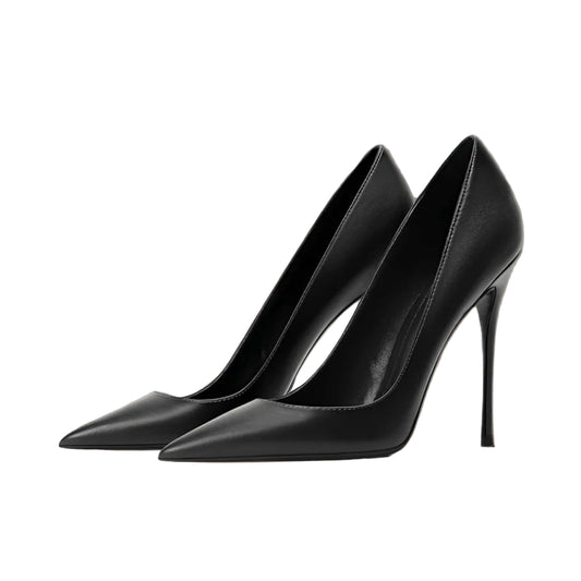 Black high-heeled shoes on a wooden stool with a neutral background