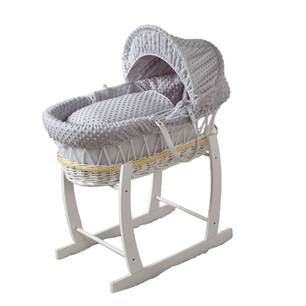 Gray wicker Moses basket with white stand on a wooden floor in a nursery setting.